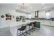 Modern kitchen with an island, pendant lighting, stainless steel appliances, and a stylish backsplash at 20961 E Stacey Rd, Queen Creek, AZ 85142