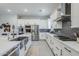 Spacious kitchen features stainless steel appliances, modern backsplash, and ample countertop space at 20961 E Stacey Rd, Queen Creek, AZ 85142