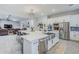 Modern kitchen features an oversized island, stainless steel appliances, and ample cabinet space at 20961 E Stacey Rd, Queen Creek, AZ 85142