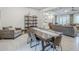 Open-concept living and dining area showcasing stylish furnishings, decorative shelving, and an inviting atmosphere at 20961 E Stacey Rd, Queen Creek, AZ 85142