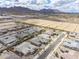 Aerial view of a neighborhood with desert landscaping and mountain views at 20961 E Stacey Rd, Queen Creek, AZ 85142