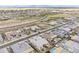 Aerial view of a neighborhood with desert landscaping, pools, and roads nearby at 20961 E Stacey Rd, Queen Creek, AZ 85142