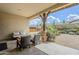 Inviting covered patio with comfortable seating area and tranquil outdoor space with desert landscaping at 20961 E Stacey Rd, Queen Creek, AZ 85142