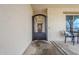 Cozy covered patio boasts elegant wrought-iron gate and comfortable seating for relaxing and enjoying the outdoors at 20961 E Stacey Rd, Queen Creek, AZ 85142