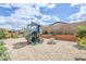 Backyard featuring a modern playhouse with slide and a small picnic table at 20961 E Stacey Rd, Queen Creek, AZ 85142