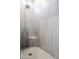 Close-up of a modern shower with tiled walls, a corner shelf, and a sleek showerhead at 20961 E Stacey Rd, Queen Creek, AZ 85142