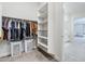Well-organized walk-in closet featuring shelves, hanging rods, and dual laundry baskets at 20961 E Stacey Rd, Queen Creek, AZ 85142