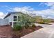 Cozy single-story home with desert landscaping and a charming exterior, featuring a tile roof at 21105 N Blue Agave Dr, Maricopa, AZ 85138