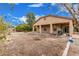 The backyard features a covered patio, potential planting areas, and a view of the home's exterior at 21752 E Domingo Rd, Queen Creek, AZ 85142