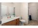 Cozy bathroom featuring single sink vanity, toilet and shower-tub combo at 21752 E Domingo Rd, Queen Creek, AZ 85142