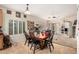 Charming dining room with a wooden table set, window shutters, and adjacent living space, perfect for Gathering gatherings at 21752 E Domingo Rd, Queen Creek, AZ 85142