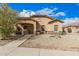 Charming single-story home with a well-maintained landscape, stone accents, and covered porch at 21752 E Domingo Rd, Queen Creek, AZ 85142