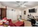 Living room with carpet, ceiling fan, sofa and television at 21752 E Domingo Rd, Queen Creek, AZ 85142