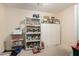 Storage room with shelving and overhead lighting at 21752 E Domingo Rd, Queen Creek, AZ 85142