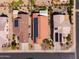 Overhead view of homes with landscaping, driveways, roofs with clay tiles, and solar panels at 22520 W Moonlight Path, Buckeye, AZ 85326