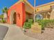 Community entrance featuring desert landscaping, a walkway, and signage indicating the name 'Sundance' at 22520 W Moonlight Path, Buckeye, AZ 85326