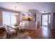 Bright dining area open to kitchen featuring hardwood floors and modern decor at 22520 W Moonlight Path, Buckeye, AZ 85326