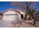 Charming single-story home with a well-maintained yard and attached two-car garage at 22520 W Moonlight Path, Buckeye, AZ 85326