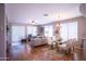 Open concept living room and dining area filled with natural light and ample seating at 22520 W Moonlight Path, Buckeye, AZ 85326