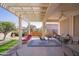 Spacious outdoor patio under a pergola, perfect for dining and lounging at 22520 W Moonlight Path, Buckeye, AZ 85326