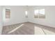 Bright bedroom with neutral carpet, white walls, and natural light from multiple windows at 24134 N 172Nd Ave, Surprise, AZ 85387