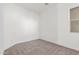 Bedroom featuring neutral carpet, white walls, and natural light from window at 24134 N 172Nd Ave, Surprise, AZ 85387