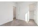 Bright, spacious bedroom with neutral carpet and convenient access to a closet and bathroom at 24134 N 172Nd Ave, Surprise, AZ 85387