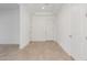 Bright entryway with tile flooring, white doors, and neutral walls at 24134 N 172Nd Ave, Surprise, AZ 85387