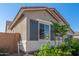 Charming single-story home featuring a well-manicured lawn and lush green landscaping at 24134 N 172Nd Ave, Surprise, AZ 85387