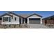 Charming single story home with a two car garage, stone landscaping and a low maintenance desert yard at 24134 N 172Nd Ave, Surprise, AZ 85387