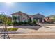 Charming single-story home with desert landscaping, a two-car garage, and a tile roof at 24134 N 172Nd Ave, Surprise, AZ 85387
