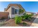 Charming single-story home with low-maintenance landscaping, shuttered windows, and a tile roof at 24134 N 172Nd Ave, Surprise, AZ 85387