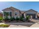 Charming single-story home featuring desert landscaping, a tile roof, and a two-car garage at 24134 N 172Nd Ave, Surprise, AZ 85387