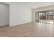 Open living space with light tile floors and sliding glass doors at 24134 N 172Nd Ave, Surprise, AZ 85387