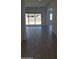 Spacious living room featuring tile flooring and sliding glass doors leading to the backyard at 24134 N 172Nd Ave, Surprise, AZ 85387