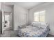 Sunlit bedroom with ample natural light, closet, and easy access to an adjacent space, creating a cozy feel at 24408 W Ripple Rd, Buckeye, AZ 85326