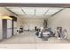 Spacious two-car garage with ample storage space and work area at 24408 W Ripple Rd, Buckeye, AZ 85326