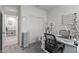 Bright hobby room with storage and natural light, adjacent to another room with sliding door access at 24408 W Ripple Rd, Buckeye, AZ 85326