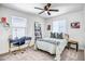 Cozy bedroom with a comfortable bed, a study desk, and natural lighting at 2484 N Stone Hill Rd, Buckeye, AZ 85396