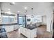 Bright, open kitchen with island seating flows into the living room at 2484 N Stone Hill Rd, Buckeye, AZ 85396