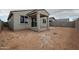 Backyard features a covered patio, block fence, and a blank canvas for creating a custom outdoor space at 2514 E Music Mountain Ave, Apache Junction, AZ 85119