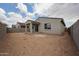 Spacious backyard with covered patio, block fence, and potential for landscaping and outdoor living at 2514 E Music Mountain Ave, Apache Junction, AZ 85119