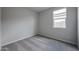 A clean and bright bedroom features neutral carpet and a window for natural light at 2514 E Music Mountain Ave, Apache Junction, AZ 85119