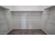 Spacious walk-in closet with ample shelving and clothing rods for storage at 2514 E Music Mountain Ave, Apache Junction, AZ 85119