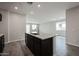 A modern kitchen features a granite-topped island and wood-look tile flooring at 2514 E Music Mountain Ave, Apache Junction, AZ 85119