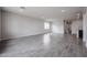 A spacious living room features recessed lighting and wood-look tile flooring at 2514 E Music Mountain Ave, Apache Junction, AZ 85119