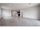 Open floorplan showing living room and eat-in kitchen with tile flooring and recessed lights at 2514 E Music Mountain Ave, Apache Junction, AZ 85119