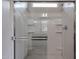 Clean, bright walk-in shower with a glass door and built-in shelves for convenience at 2514 E Music Mountain Ave, Apache Junction, AZ 85119