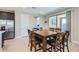 Bright dining room with wood table and views of the outdoor patio at 26978 N 74Th Ln, Peoria, AZ 85383