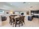Open dining and living area with tile floors, recessed lighting and modern kitchen at 26978 N 74Th Ln, Peoria, AZ 85383